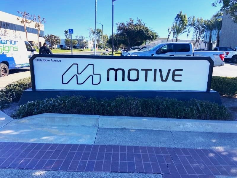 Refurbished monument sign with new letters for Motive Energy in Tustin