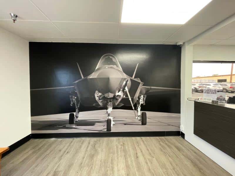 Floor-to-ceiling fighter jet wall wrap in the SON-AERO lobby in Anaheim